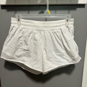 White Lululemon shorts with built in material. Worn once.